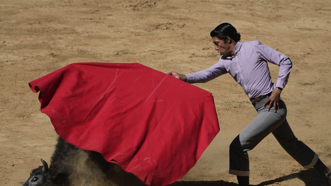 Mexican bullfighter Sergio Flores demonstrates his capework during a bullfighting workshop, in Aculco, Mexico, Jan. 25, 2024.
