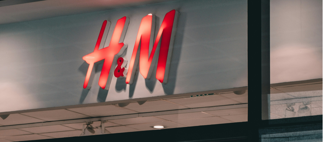 H&M red sign above a store on the street.